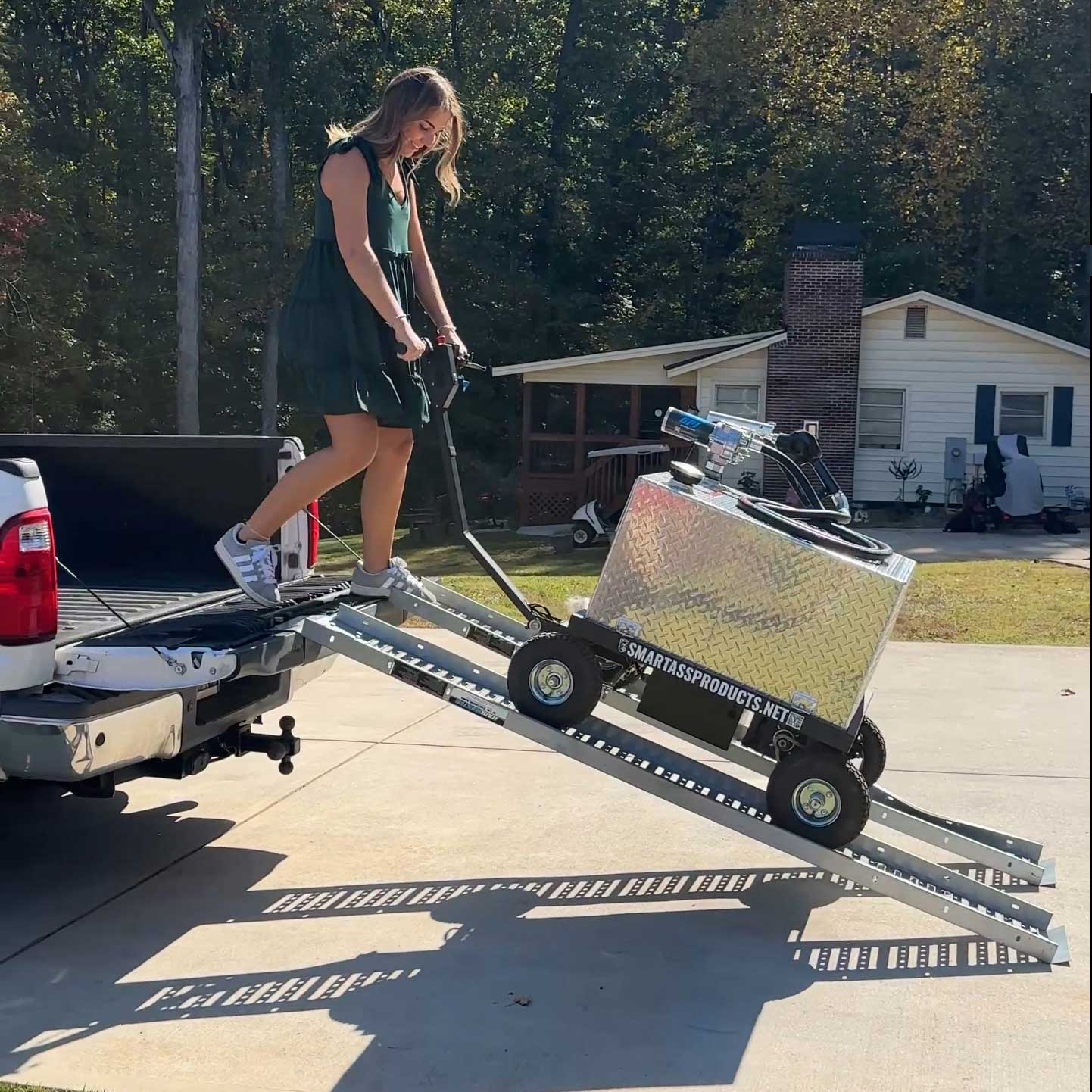 Camille unloading a Smart Ass Fuel Mule from a truck while full of fuel