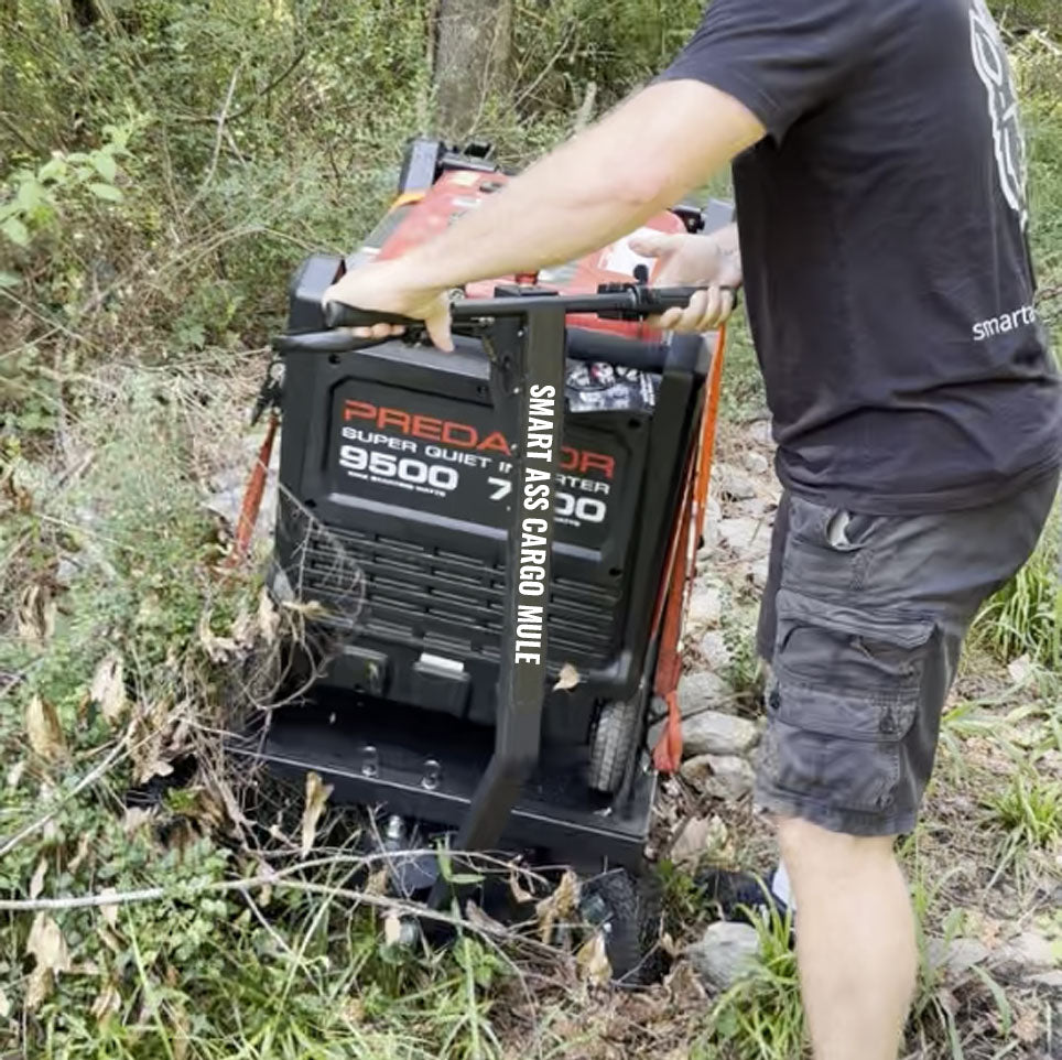 Smart Ass Cargo Mule Muscling a Predator 9500 Generator around a locked gate over a pile of rocks and rubble